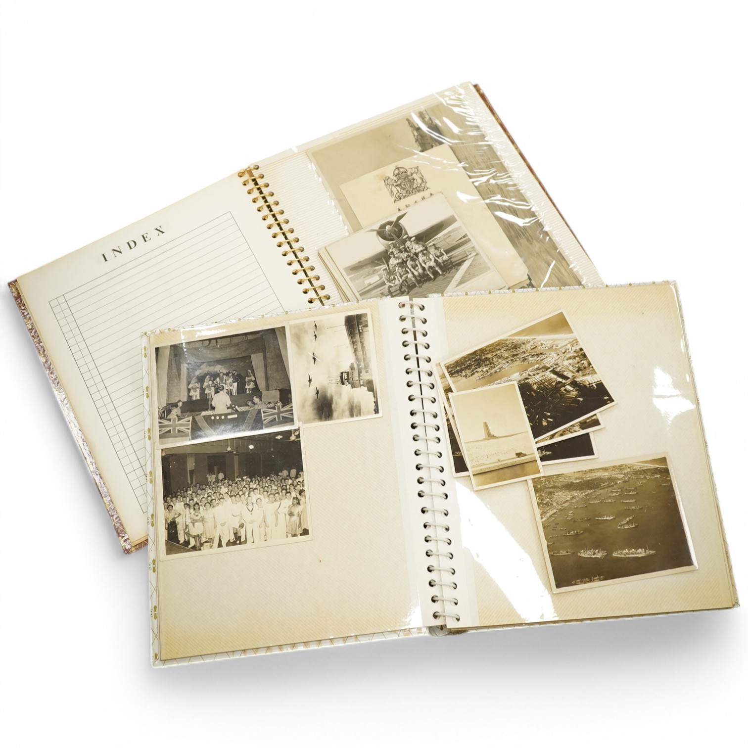 Two photograph albums containing an archive of WWII photos mainly of the RAF in Japan and the Far East, including a number of photos of RAF aircraft, aircraft carriers, Royal Naval ships, photographs of crew, military so